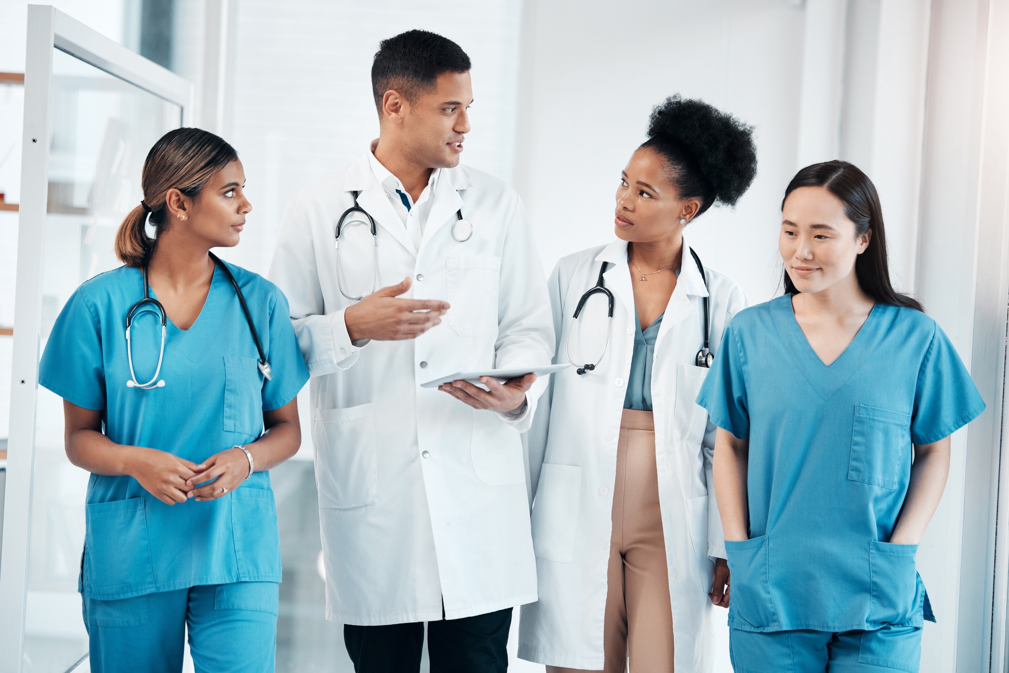 Doctor team tablet, hospital conversation and healthcare staff communication with data. Teamwork, n