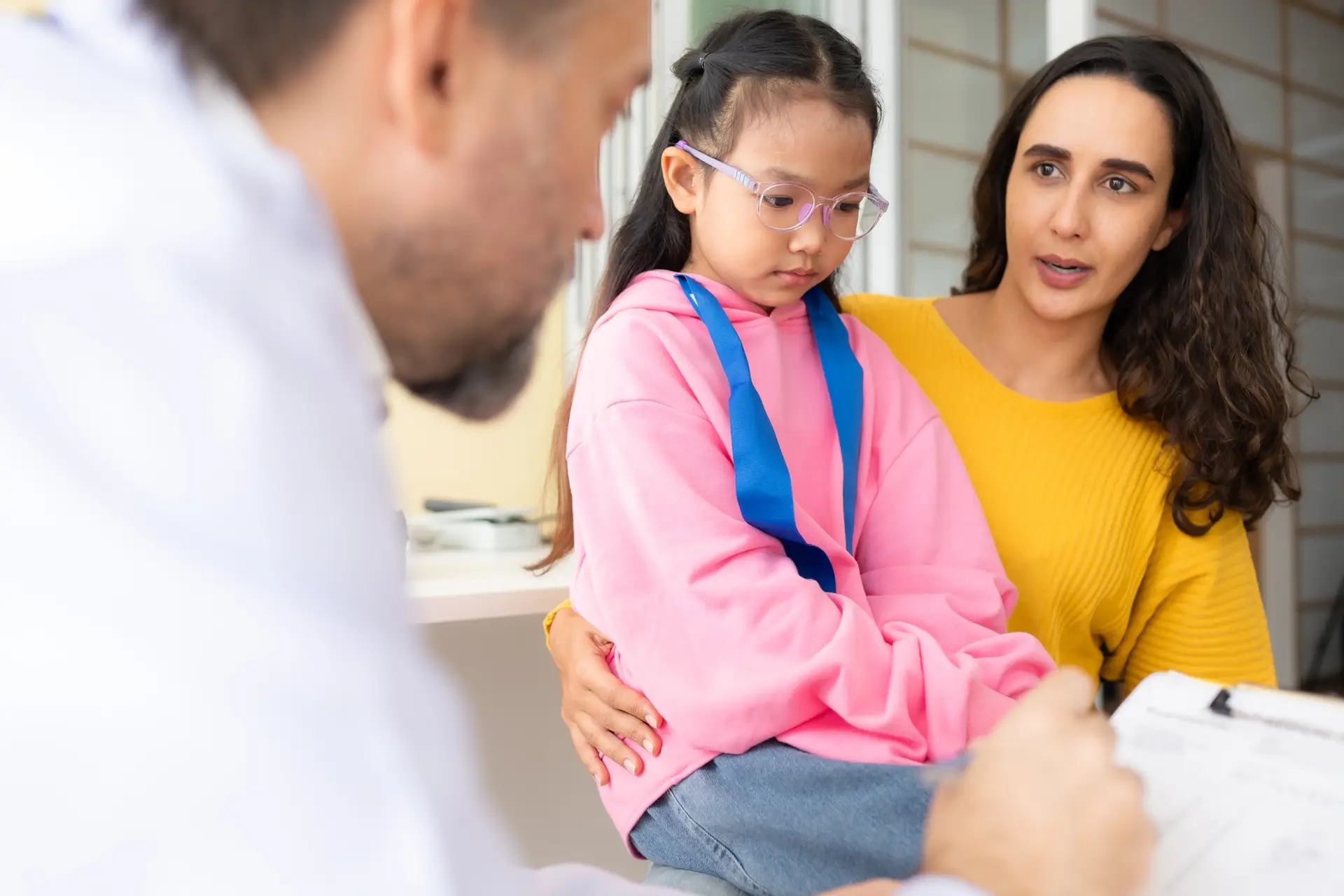 Psychotherapist working with child patient and mother in office, Concept of psychotherapy