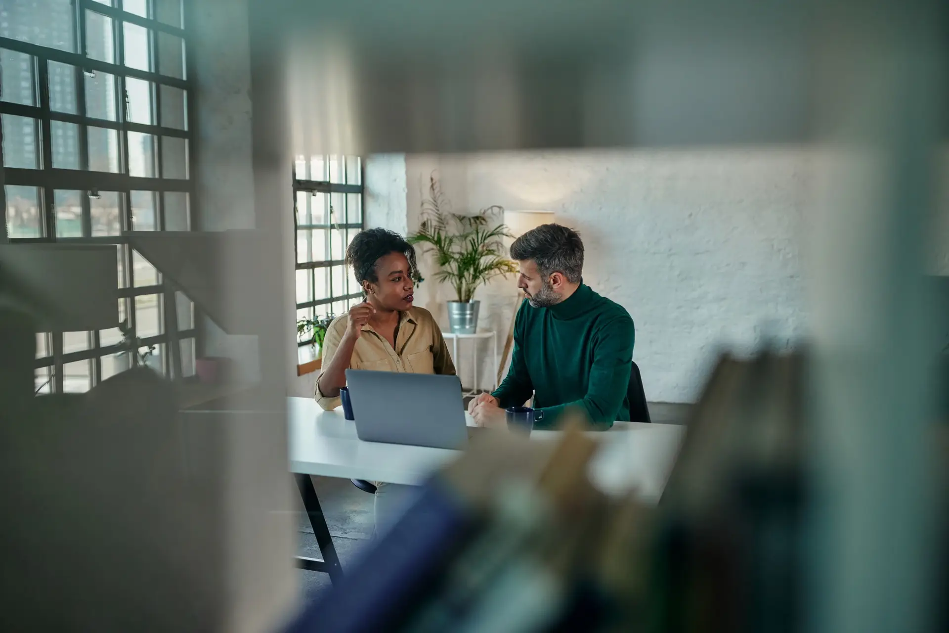 Young couple discussing problems with online therapist